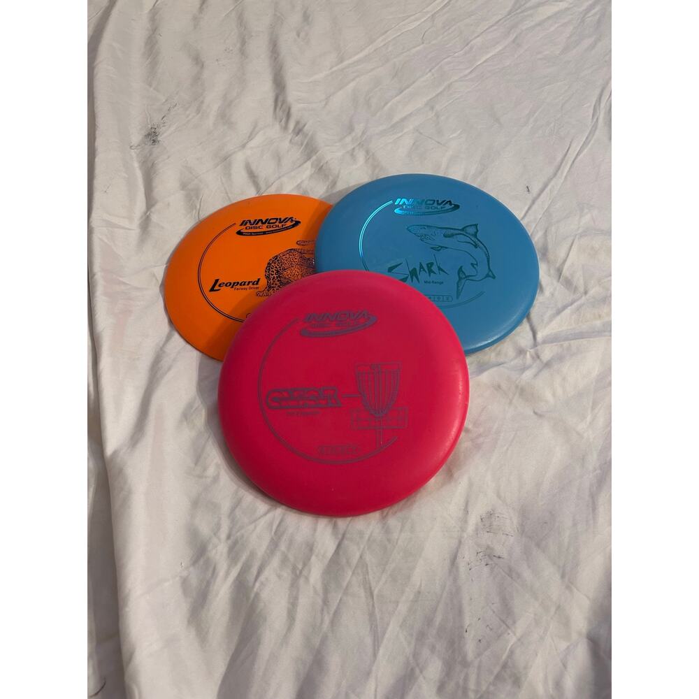 Innova Disc Golf 3-Disc Set Aviar Shark Leopard pink orange and blue